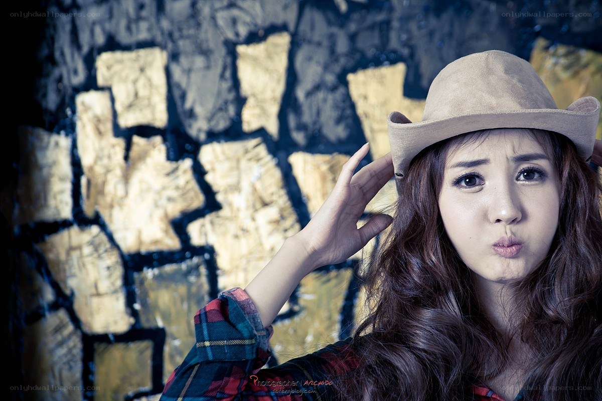 woman in cowboy hat posing