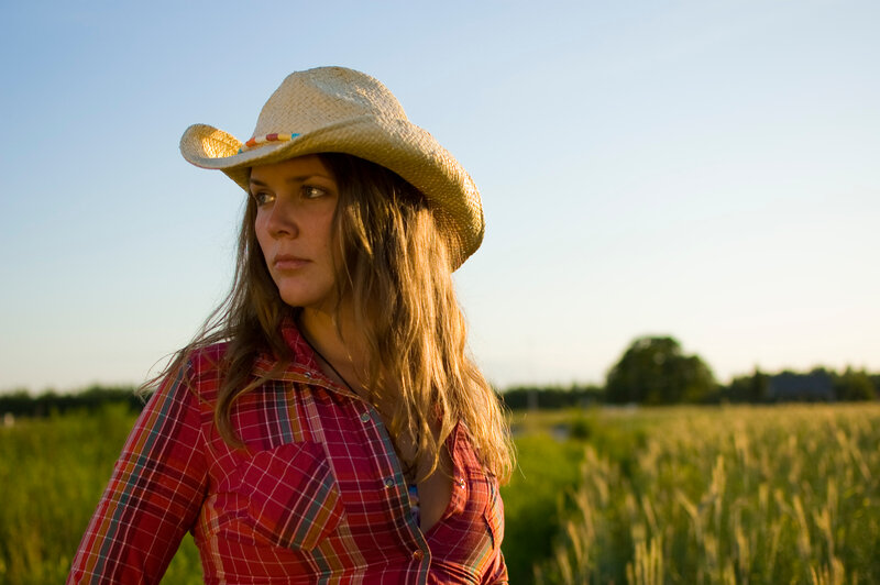 Woman in Cowboy Hat — Red, Serene, Sunset