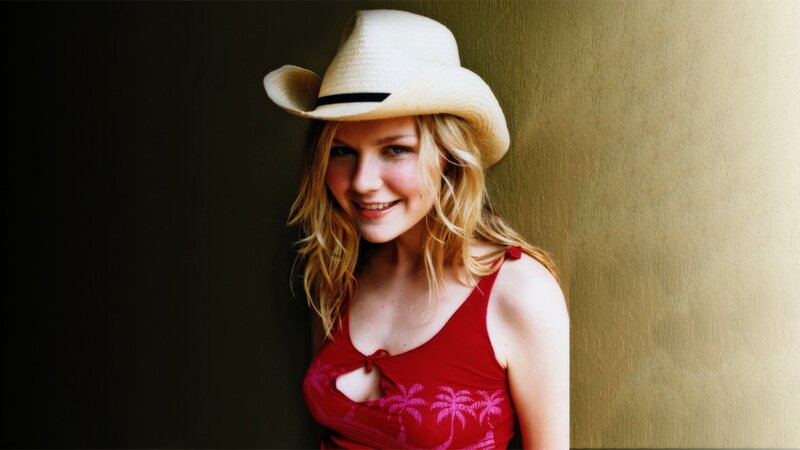woman in cowboy hat smiling