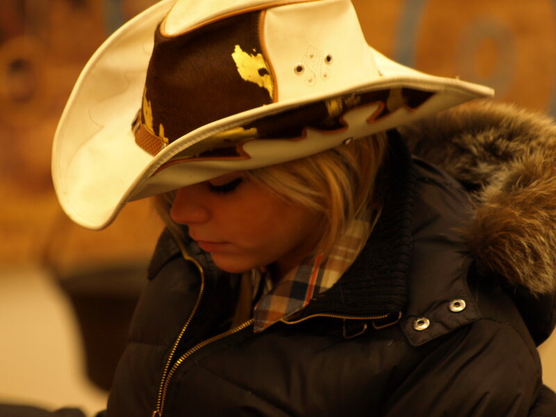 Woman in Cowboy Hat — White, Contemplative