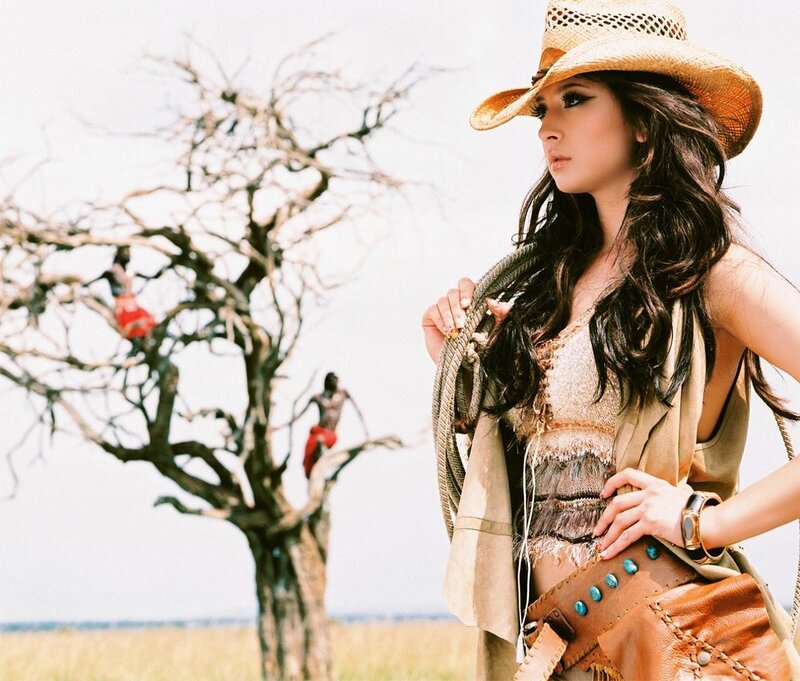 woman in cowboy hat with rope