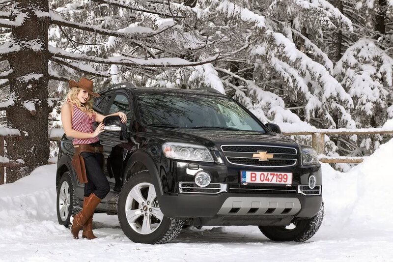 Woman in cowboy hat with SUV