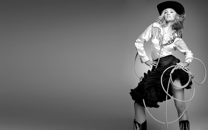 Woman in Cowboy Outfit — Black, Dramatic, Photograph