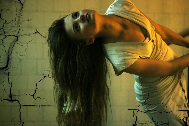 woman in cracked room