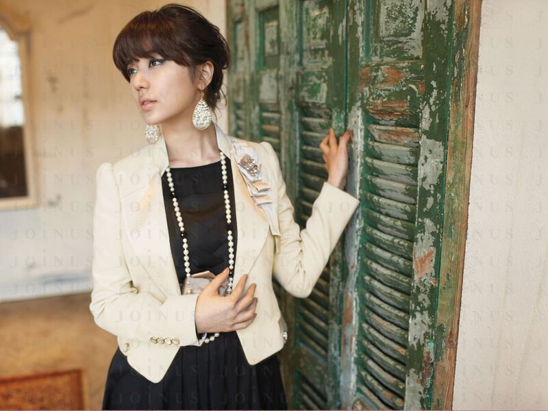 woman in cream blazer