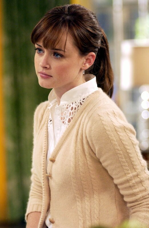 woman in cream cardigan