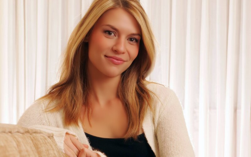 woman in cream cardigan