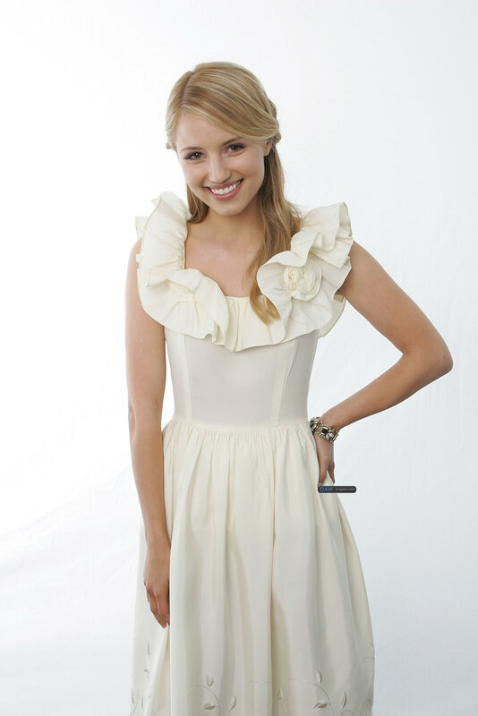 woman in cream dress smiling