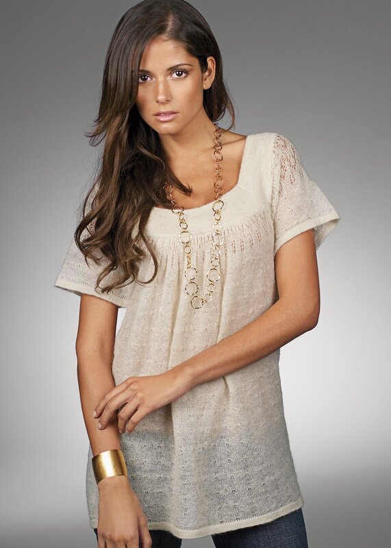 woman in cream knit top