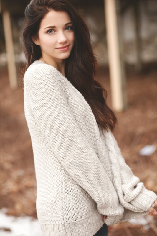 woman in cream sweater
