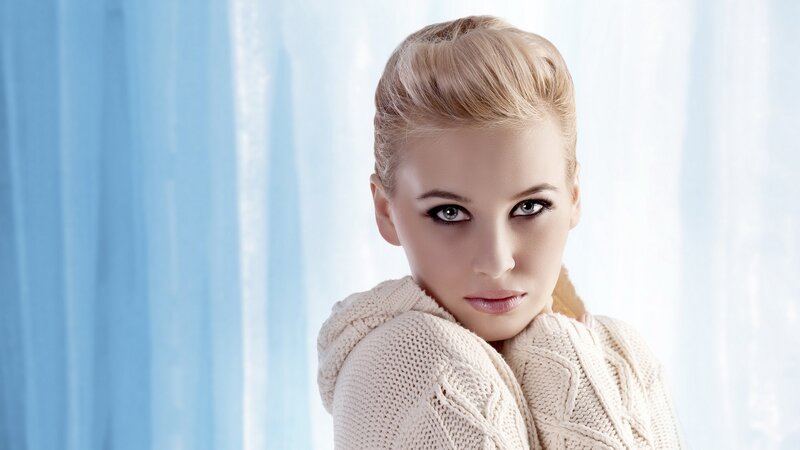 woman in cream sweater