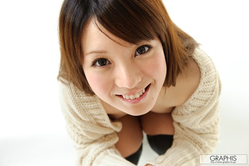 woman in cream sweater smiling