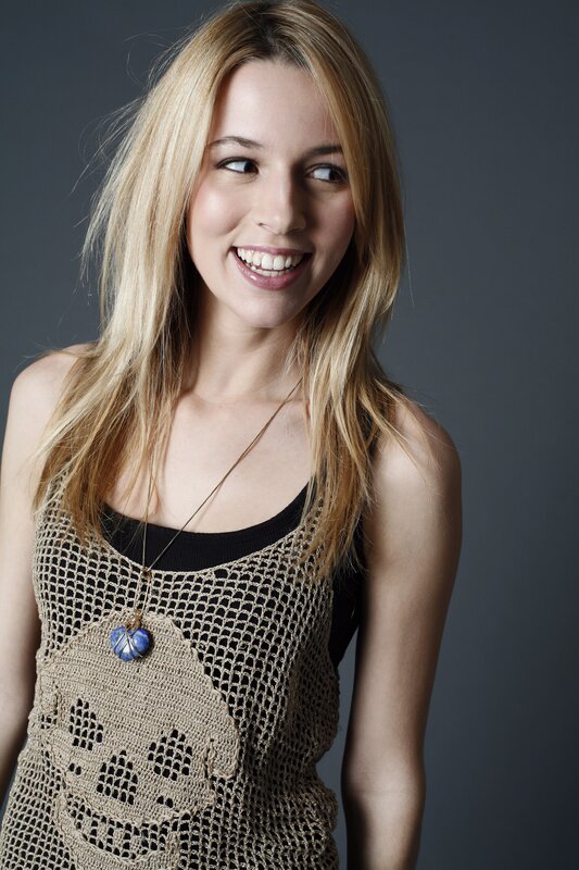 woman in crochet top smiling