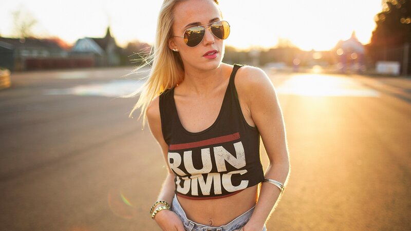 woman in crop top at sunset
