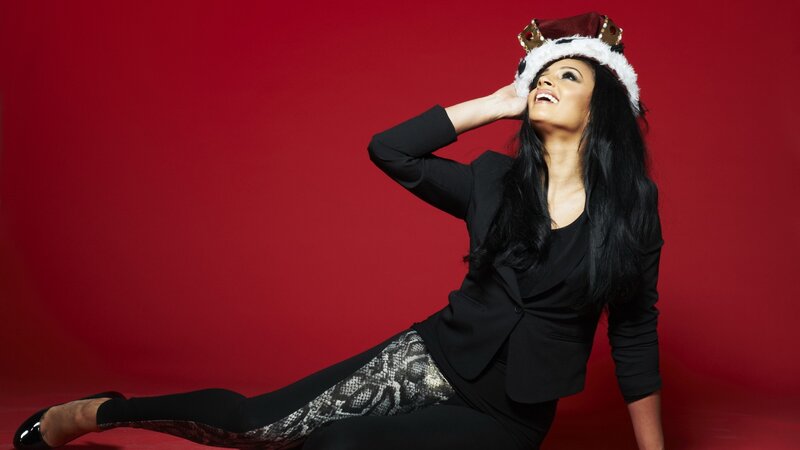 woman in crown and black suit