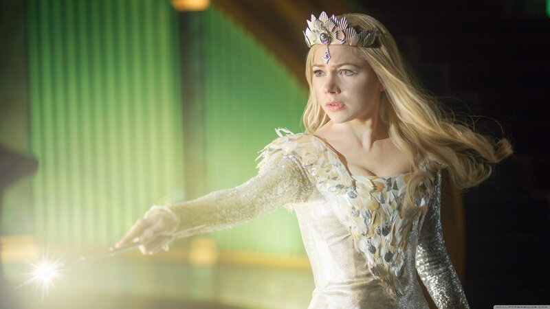 woman in crown holding wand