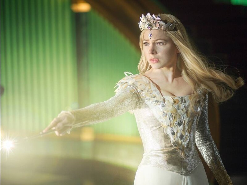 woman in crown holding wand