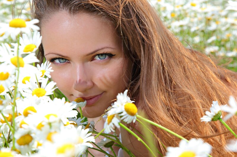 woman in daisy field