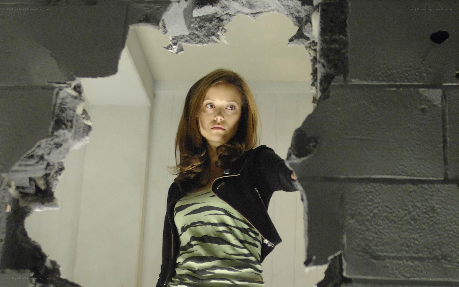 woman in damaged room