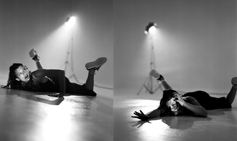woman in dance pose on floor