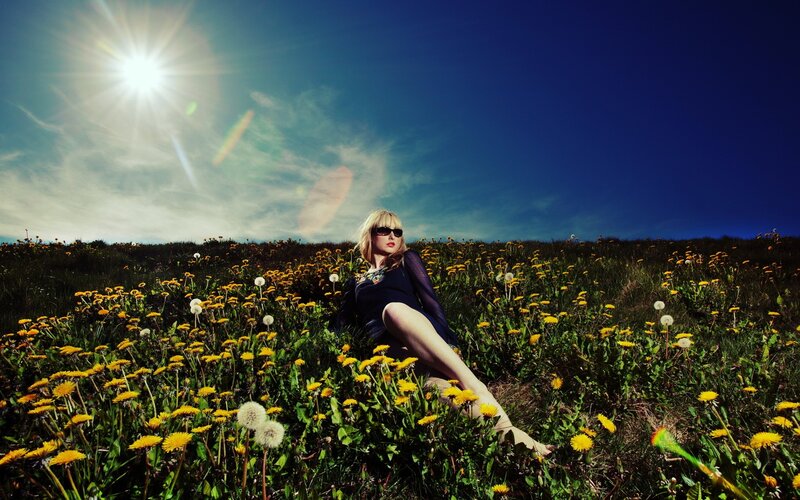 Woman in dandelion field