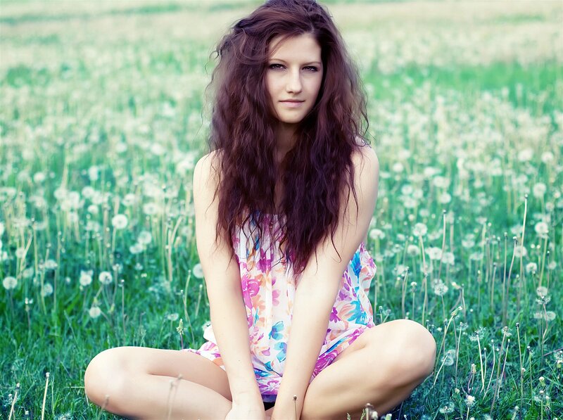woman in dandelion field