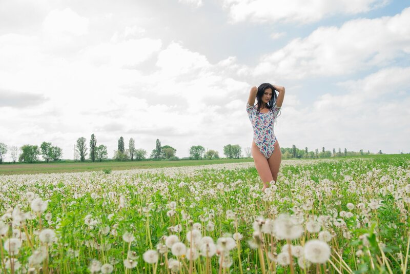 Woman in dandelion field