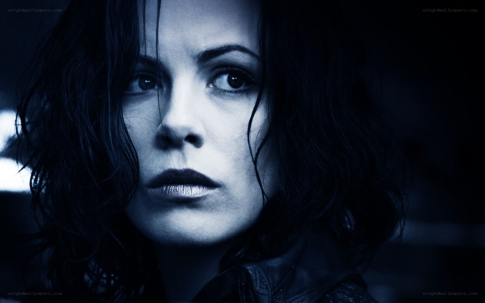 woman in dark blue lighting