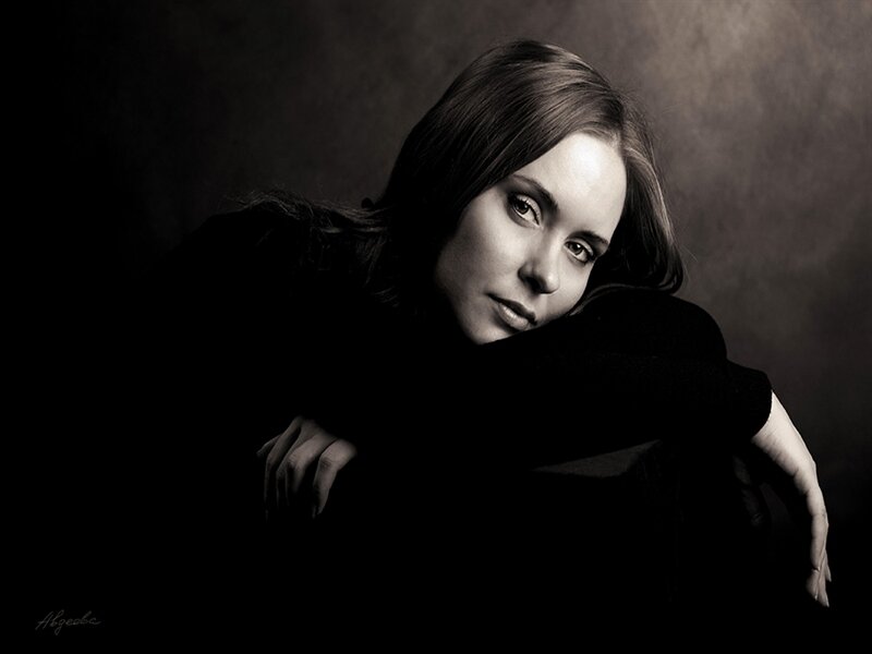 Woman in Dark Clothing — Black, Dramatic, Photograph, Dark Background