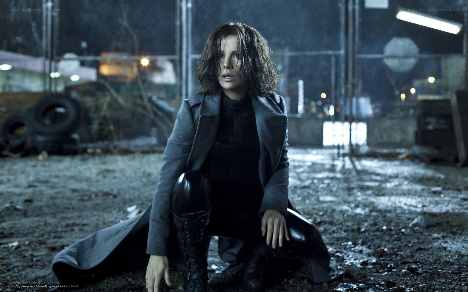 woman in dark coat crouching