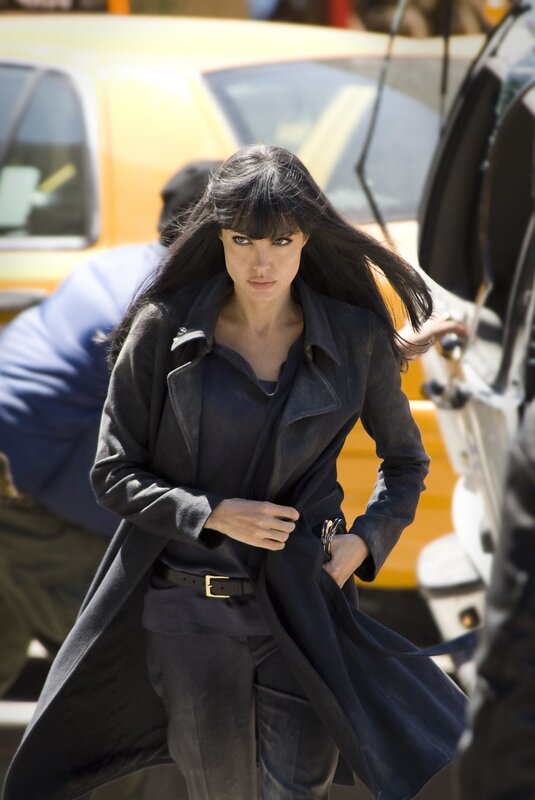 woman in dark coat walking
