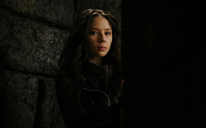 woman in dark corridor