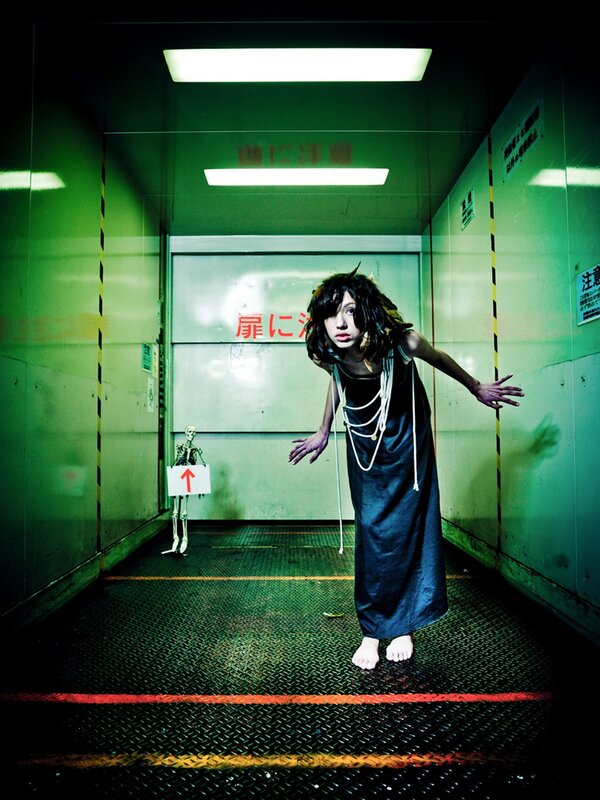 woman in dark dress in elevator