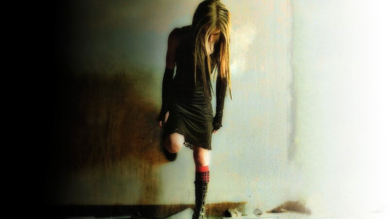 woman in dark dress standing