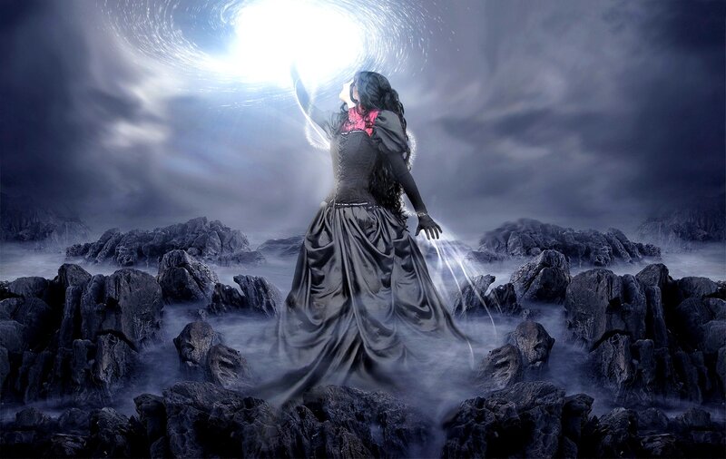 woman in dark dress under light