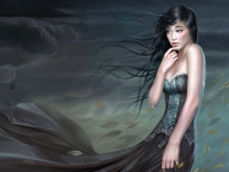 woman in dark dress with flowing hair