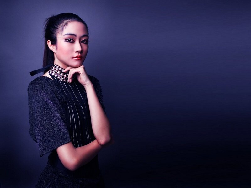 woman in dark dress with makeup