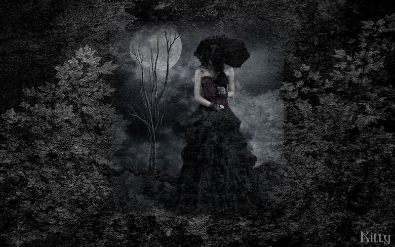 woman in dark forest at night
