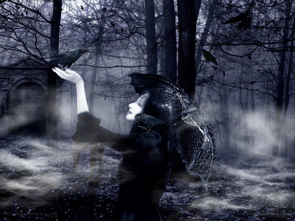 woman in dark forest with crows