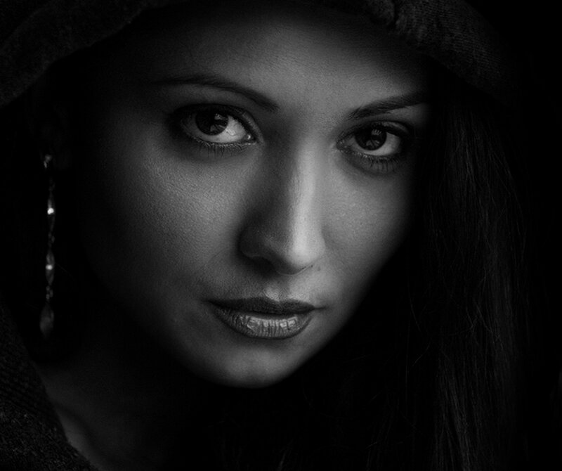 Woman in Dark Hat — Black, Dramatic