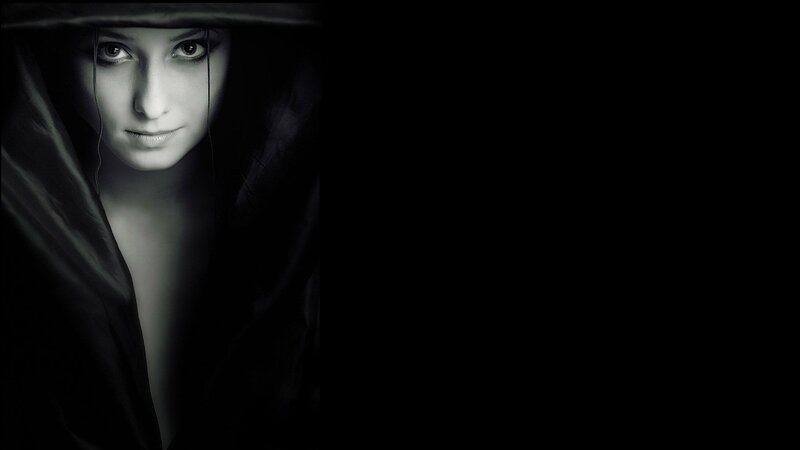 woman in dark hood