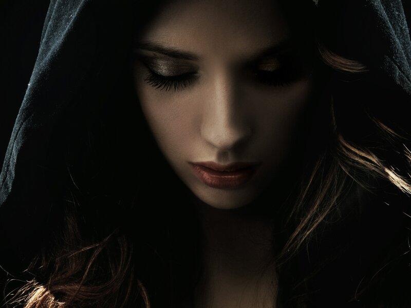 woman in dark hood