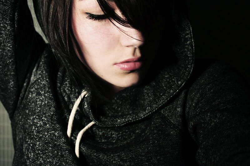 woman in dark hoodie