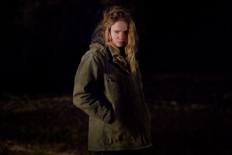 woman in dark jacket at night