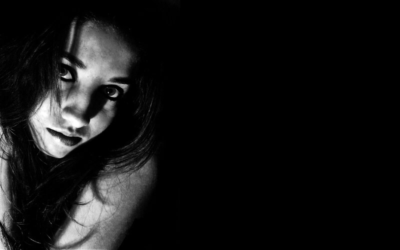 woman in dark lighting