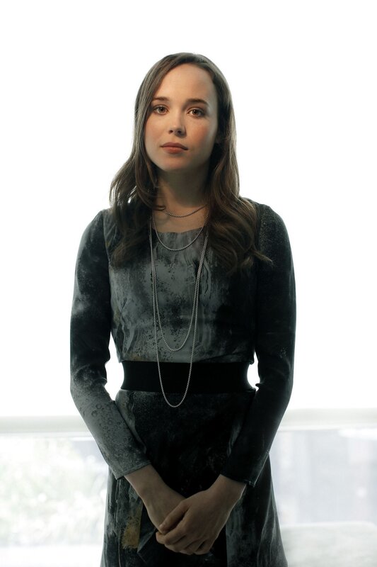 woman in dark patterned dress