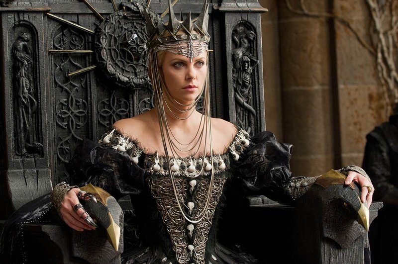 Woman in dark regal attire