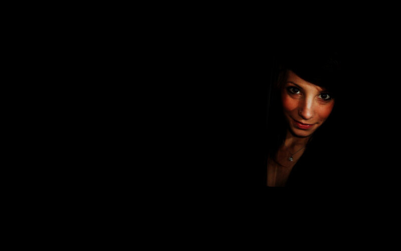 woman in dark room