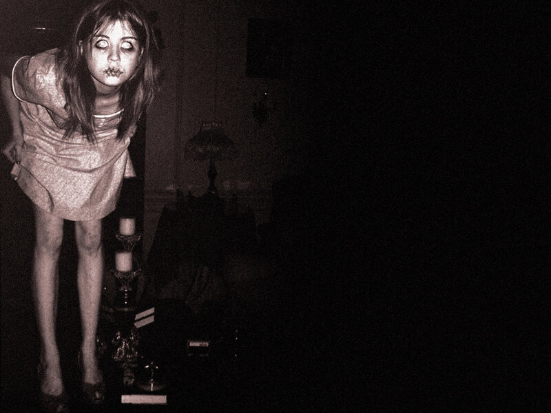 woman in dark room with makeup