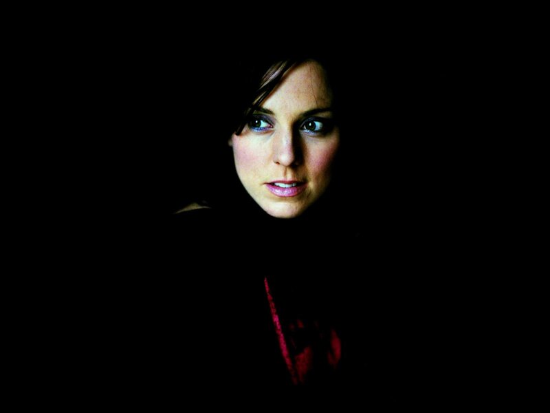 Woman in Dark Setting — Black, Dramatic, Photograph, Face, Dark Background